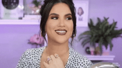 Woman With Braces Smiling In Mirror GIF