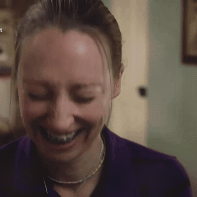 Woman With Braces Smiling In Purple Shirt GIF