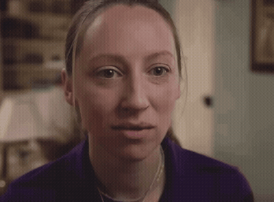 Woman With Braces Smiling In Purple Shirt GIF