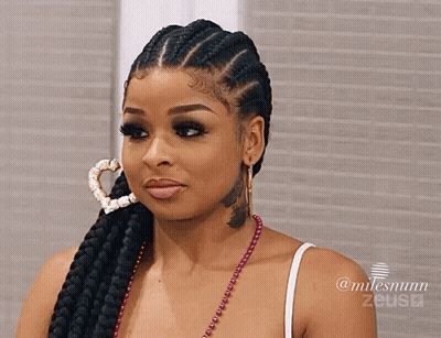 Woman With Braided Hair And Heart Hoop Earring And Neck Tattoo GIF