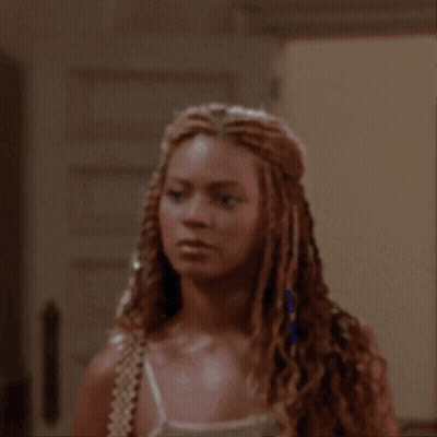 Woman With Braided Hair Looking Surprised GIF