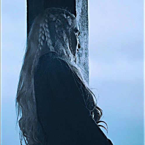 Woman With Braided Hair Standing By Pole GIF