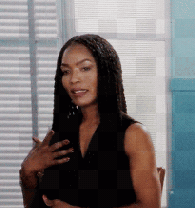 Woman With Braided Hair Standing In Front Of Window GIF