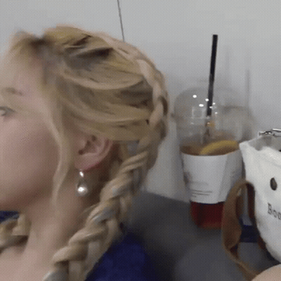 Woman With Braided Hairstyle And Earrings GIF