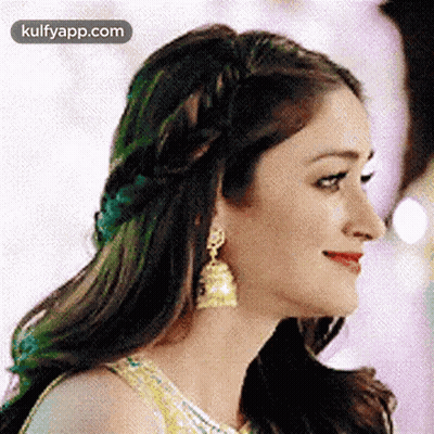 Woman With Braided Headband And Earrings GIF