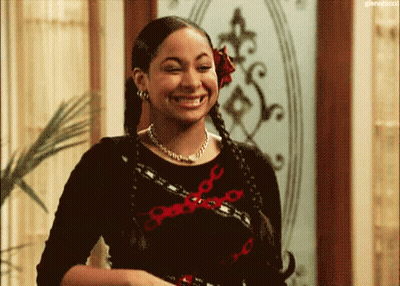Woman With Braids And Flower Smiling GIF