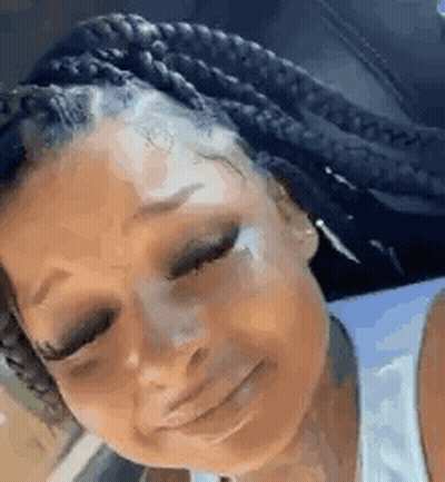 Woman With Braids Crying Tear From Nose GIF