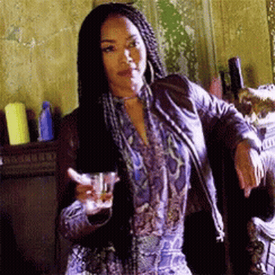 Woman With Braids Holding Glass Of Alcohol GIF