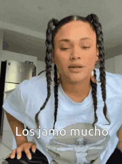 Woman With Braids In White T-Shirt Saying Los Jamo Mucho GIF