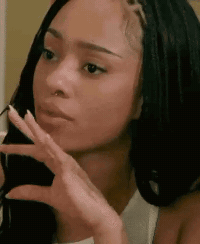 Woman With Braids Making Funny Face GIF