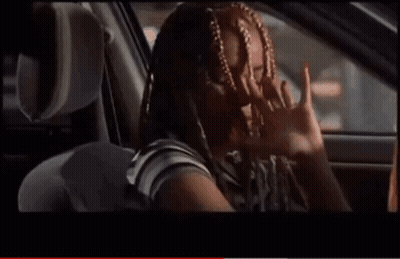 Woman With Braids Smiling In Back Seat Of Car GIF