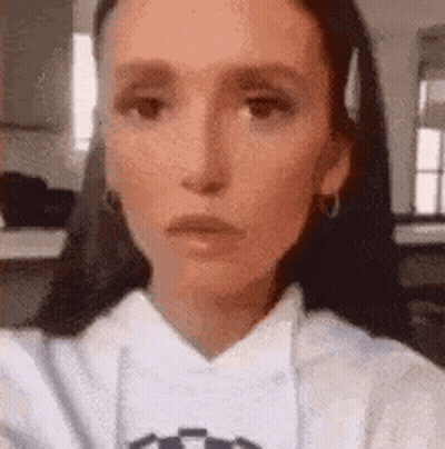 Woman With Braids Smiling In Kitchen GIF