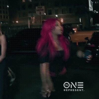 Woman With Bright Pink Hair Standing In Front Of Pay Here Sign GIF
