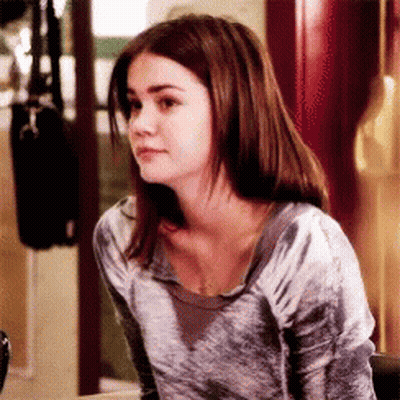 Woman With Brown Hair Wearing Gray Sweater GIF