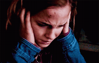 Woman With Bruise On Forehead Covering Ears GIF