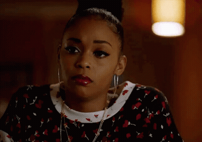 Woman With Bun Earrings And Necklace GIF