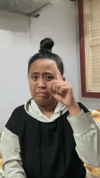 Woman With Bun Making Face GIF