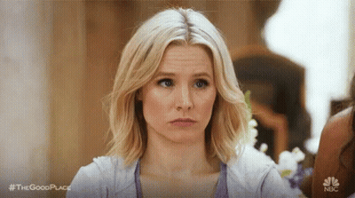 Woman With Bun Making Funny Face GIF