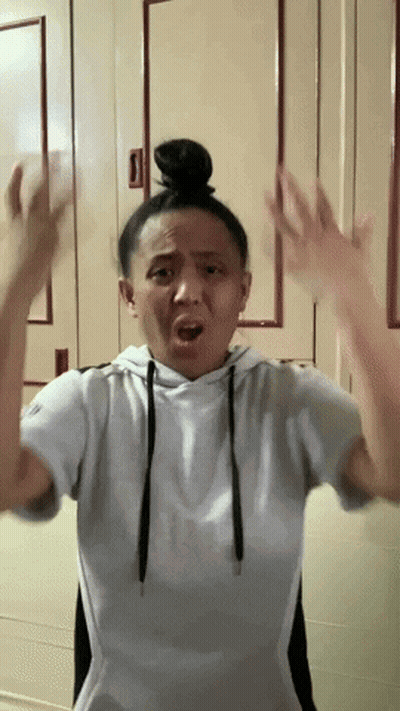 Woman With Bun Making Funny Face GIF