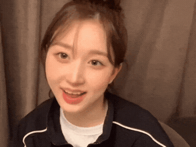 Woman With Bun On Head Close Up GIF