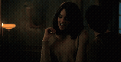 Woman With Candle In Dark Room GIF