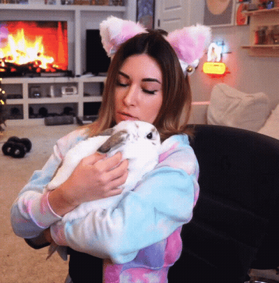 Woman With Cat Ears Holding White Rabbit GIF