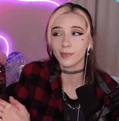 Woman With Choker And Ear Buds Looking Sideways GIF