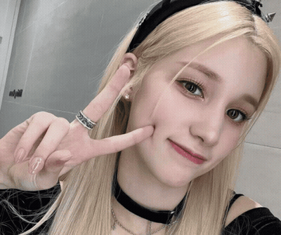 Woman With Choker And S Ring Making Peace Sign GIF