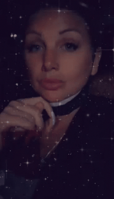 Woman With Choker Looking Down GIF