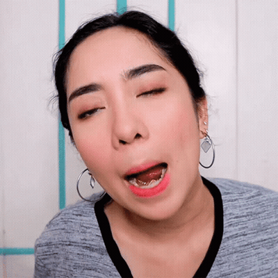 Woman With Closed Eyes And Hoop Earrings GIF