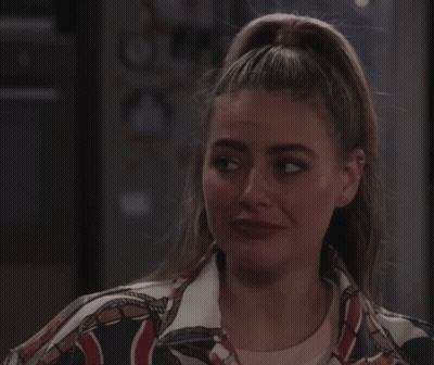 Woman With Closed Eyes In NY Jacket GIF