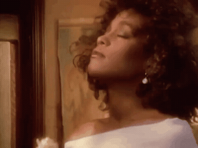 Woman With Closed Eyes In White Shirt Earrings GIF