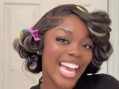 Woman With Colorful Hair Clips Smiling GIF