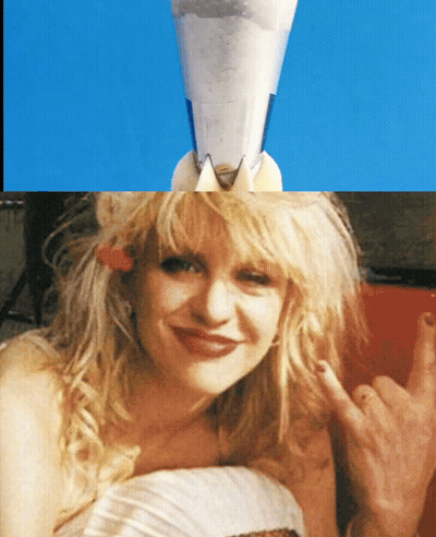 Woman With Cone And Rocket On Head GIF