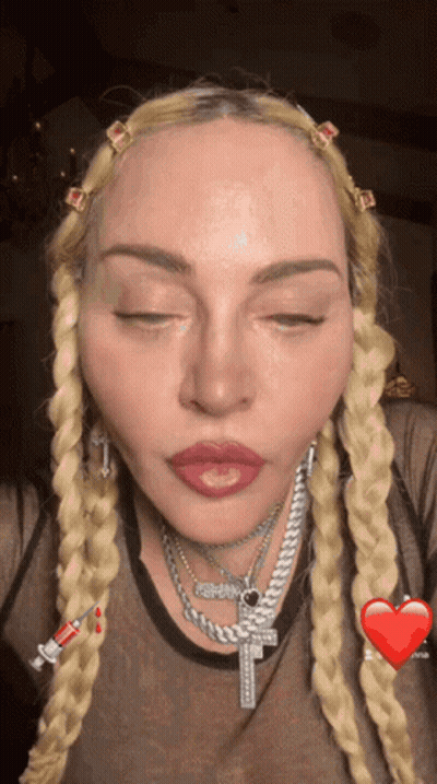 Woman With Cross Necklace GIF