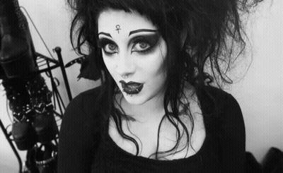 Woman With Cross On Face GIF
