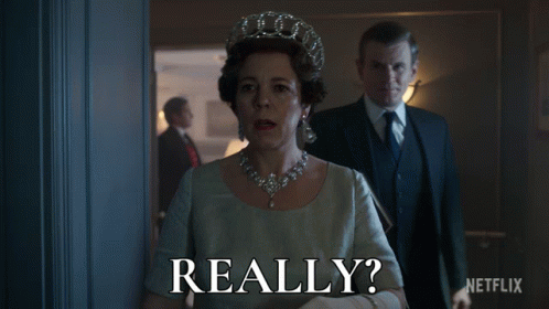 Woman With Crown Next To Man With Book Saying Really GIF
