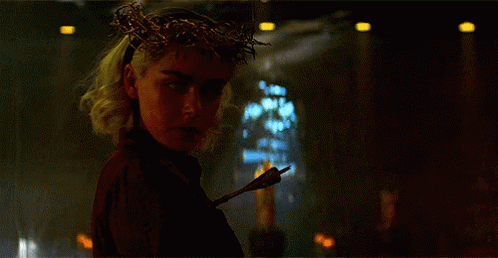Woman With Crown Of Thorns Holding Arrow GIF