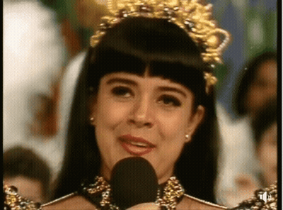 Woman With Crown Speaking Into Microphone GIF