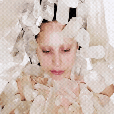 Woman With Crystal Crown Looking At Camera GIF