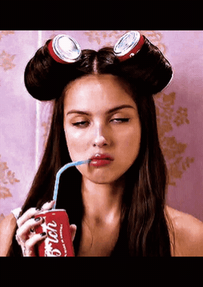 Woman With Curlers Drinking Coca Cola GIF