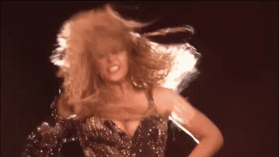 Woman With Curly Blonde Hair Dancing GIF