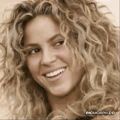 Woman With Curly Blonde Hair Smiling GIF