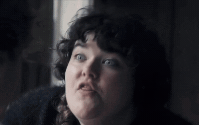 Woman With Curly Hair And Braid Looking Up At Sky GIF