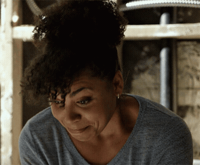 Woman With Curly Hair And Earrings GIF