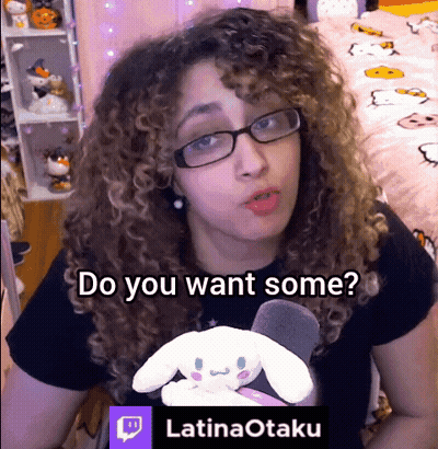 Woman With Curly Hair And Glasses Holding Stuffed Animal Says Do You Want Some GIF