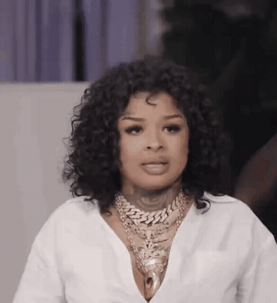 Woman With Curly Hair And Gold Chain GIF