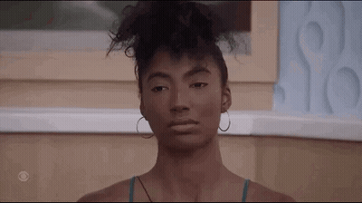 Woman with Curly Hair and Hoop Earrings