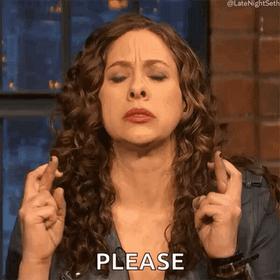 Woman With Curly Hair Crossing Fingers Making Please Sign GIF