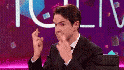 Woman With Curly Hair Crossing Fingers Making Please Sign GIF